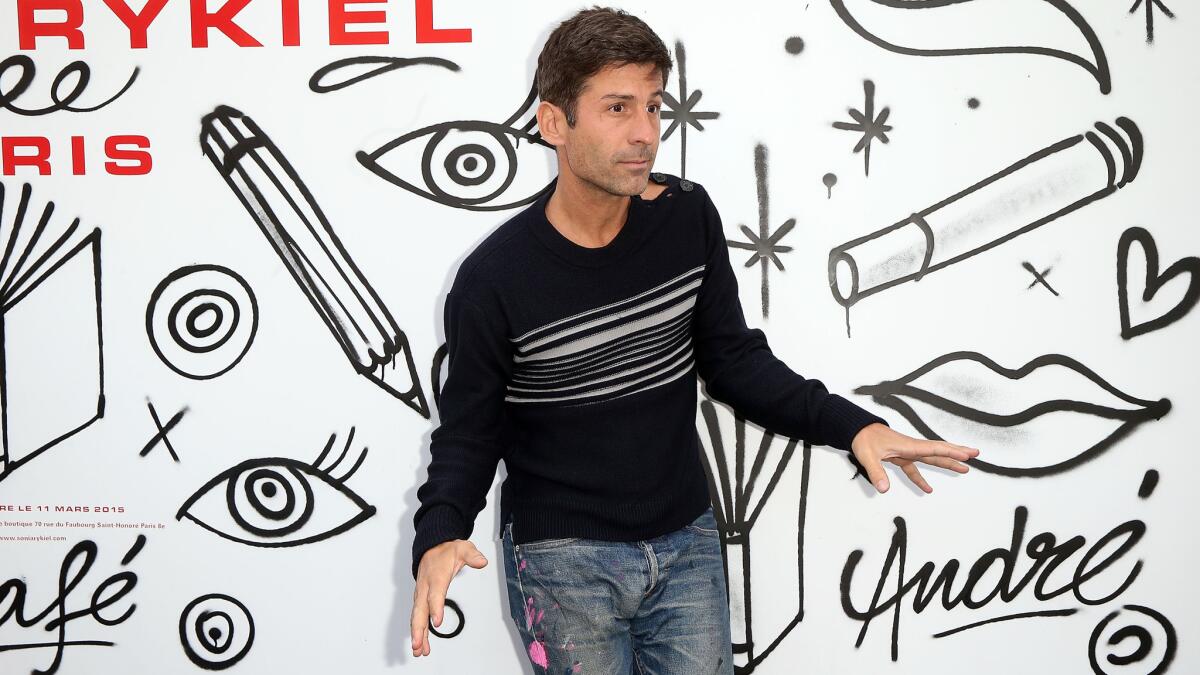 Andre Saraiva — the graffiti artist known as Mr. A — attends the Sonia Rykiel show in Paris during Fashion Week.