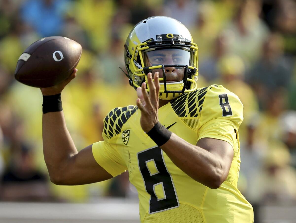 Oregon quarterback Marcus Mariota might be trading in Oregon's garish uniforms for the red and pewter of Tampa Bay.