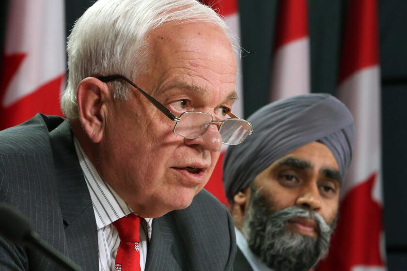 In Ontario, Immigration Minister John McCallum, left, and Harjit Sajjan, minister of National Defense, announce Canada's plan to resettle Syrian refugees.