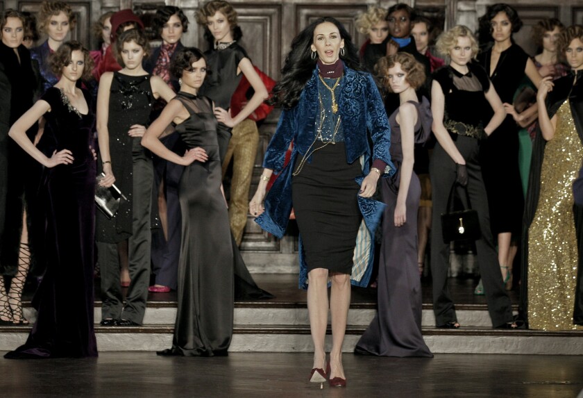 Designer L'Wren Scott, center, shown after her Fall 2012 collection was modeled during Fashion Week, in New York, was found dead Monday, March 17, 2014, in Manhattan of a possible suicide.