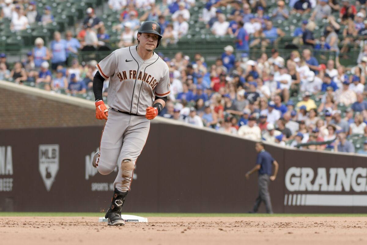 San Francisco Giants Wilmer Flores rounds second during his two run home run against the Chicago Cubs during the fifth inning of a baseball game Sunday, Sept. 12, 2021, in Chicago. (AP Photo/Mark Black)