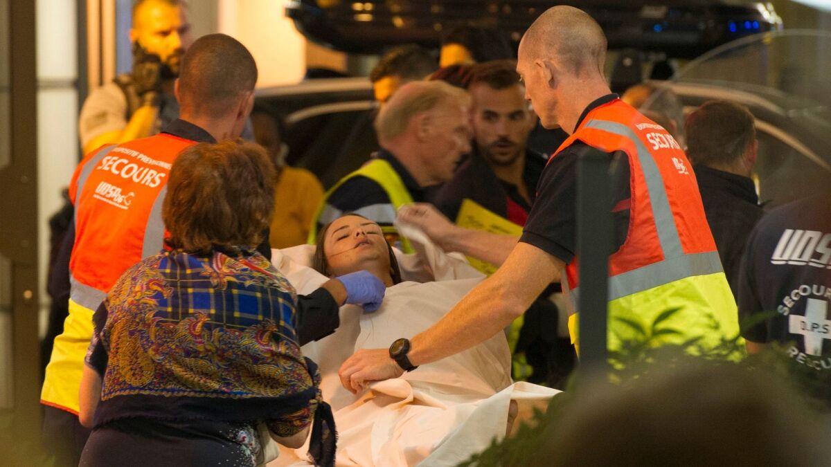 Wounded bystanders are evacuated after a truck crashed into the crowd during Bastille Day celebrations in Nice, France, on July 14, 2016. (Olivier Angrigo / European Pressphoto Agency)