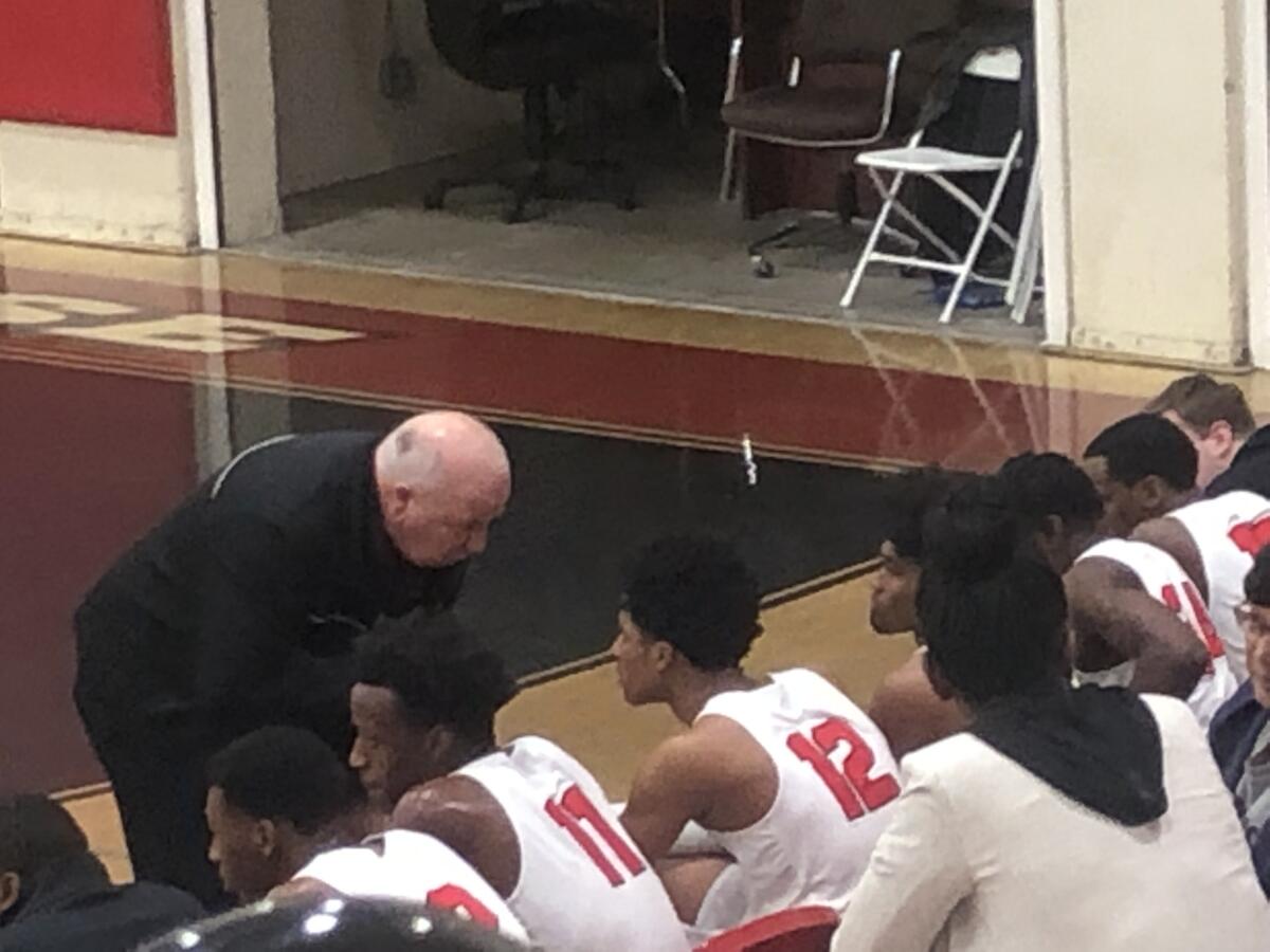 Westchester coach Ed Azzam offers some advice to 6-foot-9 Marland Harris during the Comets' 73-47 victory on Monday.