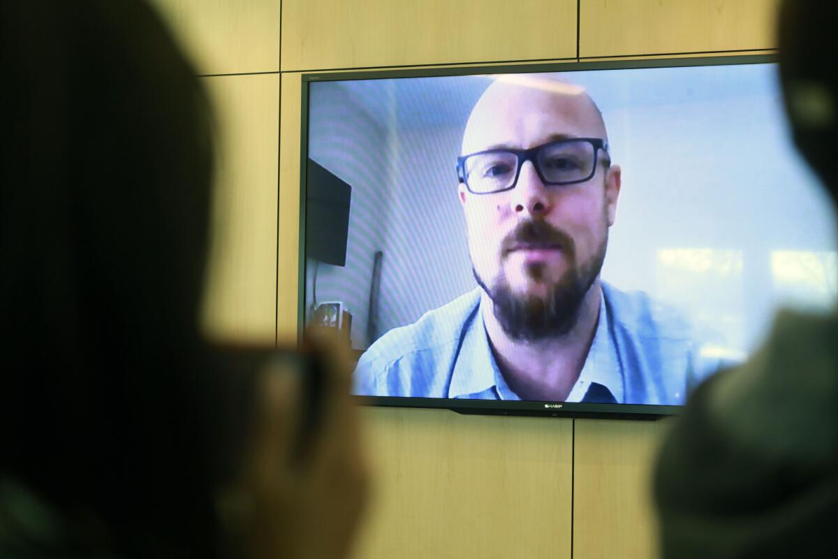 Mike Beyer, Diane Dohn's son, speaks via a video during a press conference Wednesday.
