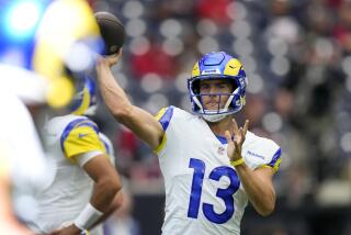 Los Angeles Rams quarterback Stetson Bennett (13) warms up before a preseason.