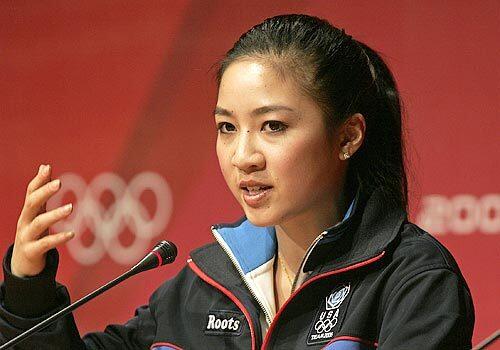Michelle Kwan addresses reporters after her first practice session, when she couldn't complete any of her jumps.