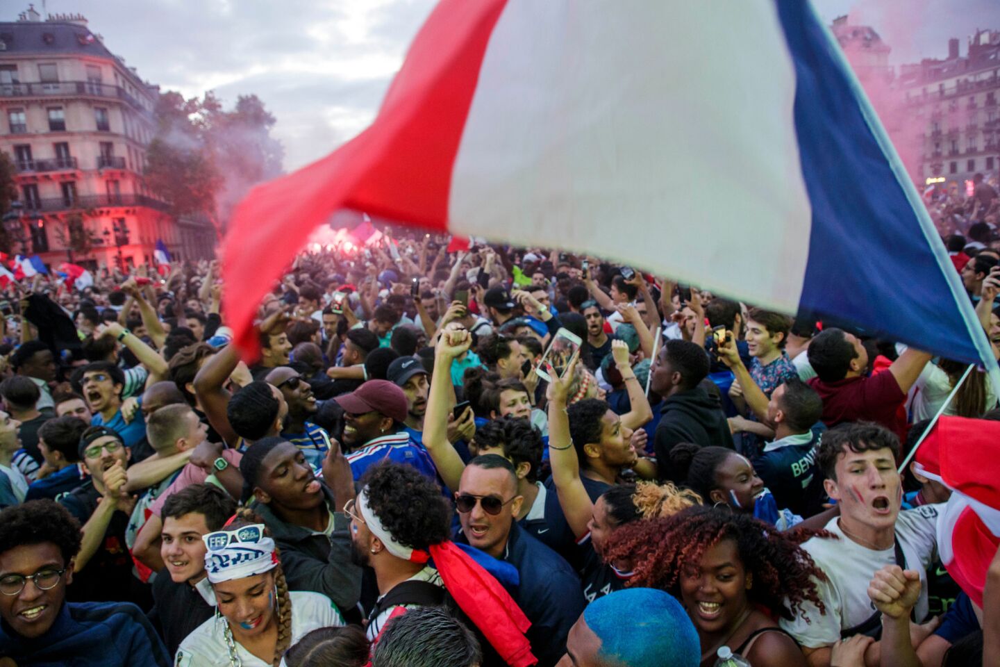 French fans at a public viewing near Paris' city hall celebrate after France beat Belgium 1-0 to advance to the finals of the World Cup.