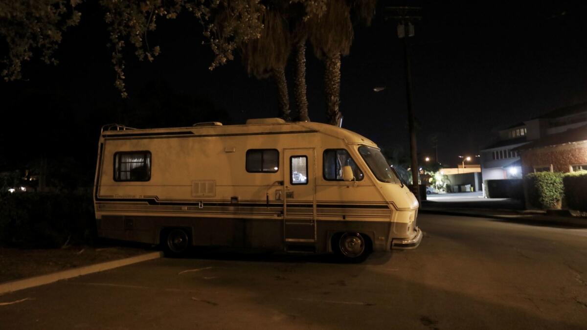 Kathy, 65, and Phil, 74, live together in this RV along with their aging Standard Poodle in a parking lot Santa Barbara.