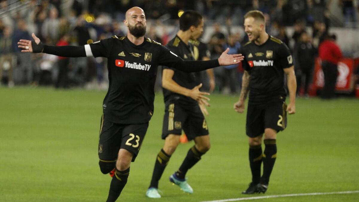 LAFC's Laurent Ciman acknowledges the cheers from the crowd after scoring the game-winning goal against the Sounders during its debut at Banc of California Stadium on April 29, 2018.