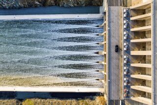 Aerial view of water flows through the Oroville Spillway