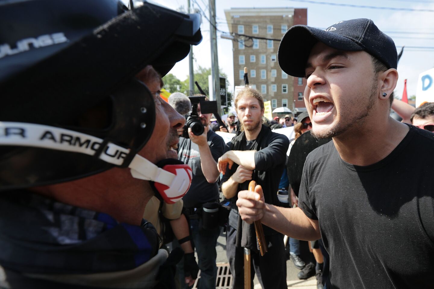 White nationalists, neo-Nazis and members of the "alt-right" square off against counter-protesters on Saturday, Aug. 12, 2017, in Charlottesville, Va.