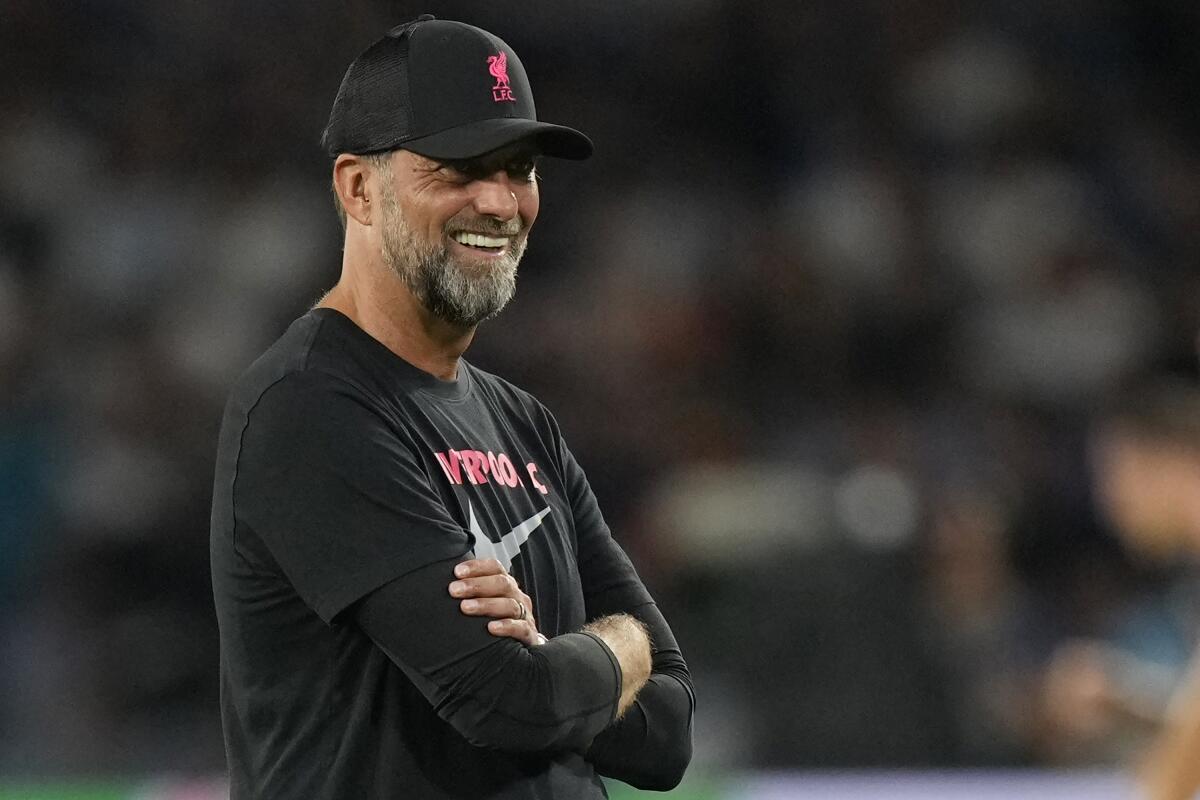 Liverpool's manager Jurgen Klopp smiles during his team's warm up before the group A Champions League soccer match between Napoli and Liverpool at the Diego Armando Maradona stadium in Naples, Italy, Wednesday, Sept. 7, 2022. (AP Photo/Andrew Medichini)