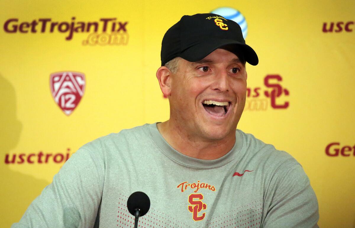 USC interim Coach Clay Helton speaks at a news conference on Oct. 13 after a Trojans practice.