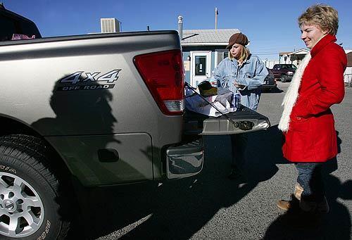 Jeffrey Kowalczyk and daughters Taylor and Brittany stop in Bridgeport to buy gas and have lunch on their way to Reno for Thanksgiving. Kowalczyk bought 27 gallons for his truck.