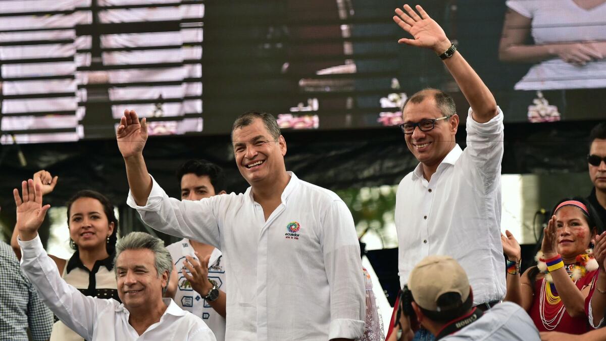 Ecuadorean President Rafael Correa, center, Alianza Pais party presidential candidate Lenin Moreno, left, and his running mate and Vice President Jorge Glas wave to supporters in Guayaquil, Ecuador, on Jan. 15, 2017.