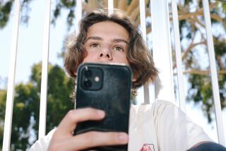 Sherman Oaks, CA - July 03: William Schnider, a 17-year-old at Van Nuys High School and a student in the medical magnet program, is against the cellphone ban at LAUSD schools, and here he poses for a portrait at Van Nuys Sherman Oaks Park on Wednesday, July 3, 2024 in Sherman Oaks, CA. (Dania Maxwell / Los Angeles Times)