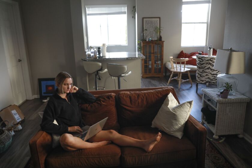 Athena Leisching, a Junior at UCSD, sits in her apartment in UTC on Thursday, July 16, 2021.(Photo by Sandy Huffaker for The San Diego Union-Tribune)