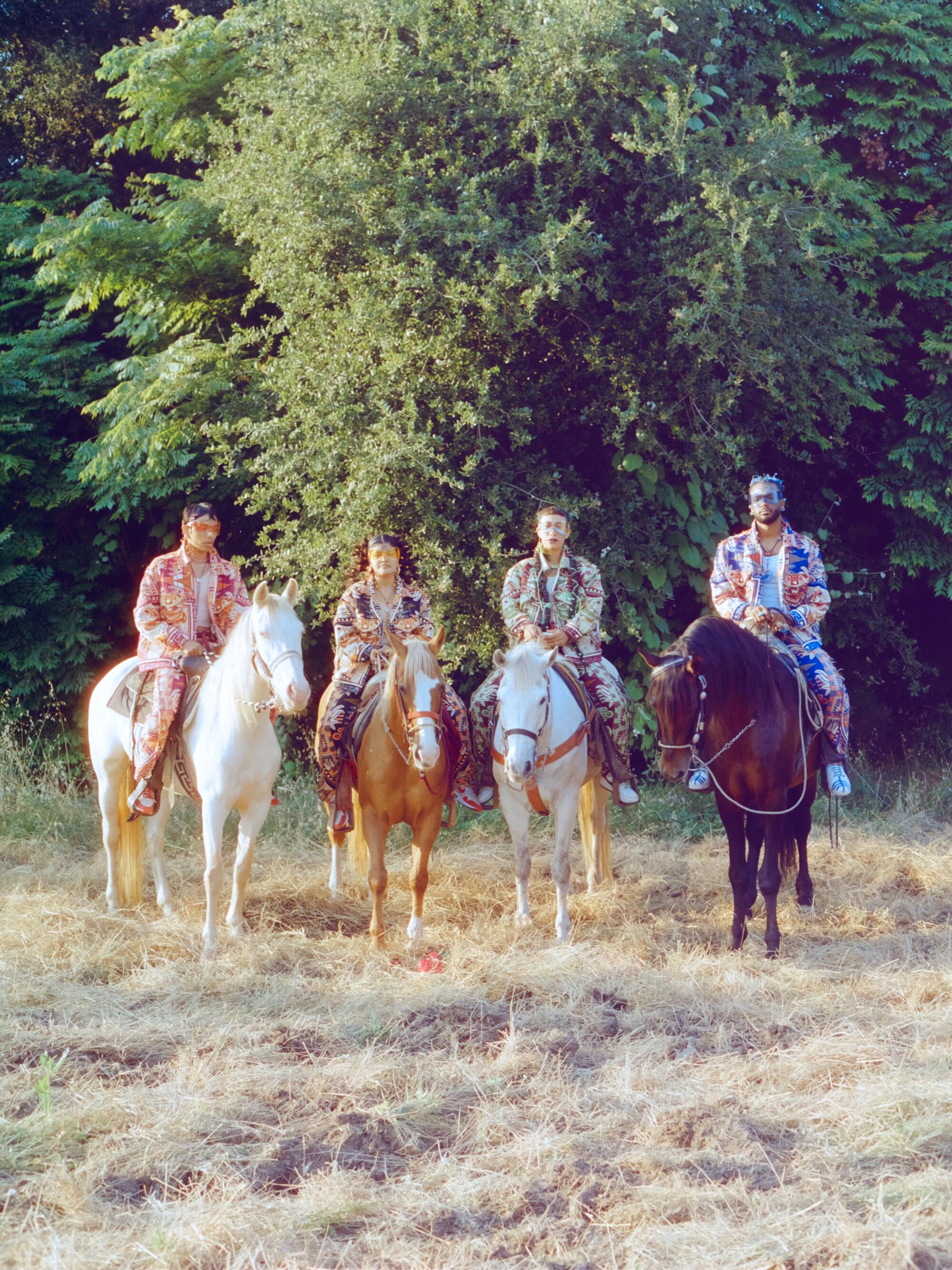 Jesus, Jamie, Maria and AJ — pictured on horses Luna, Paloma, Chulo and La Lumbre — wear Nike shoes modified by Equihua.