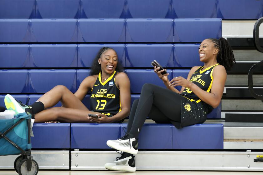 TORRANCE-CA-MAY 4, 2023: Chiney and Nneka Ogwumike, from left, share a laugh during The L.A. Sparks' media day at El Camino College in Torrance on May 4, 2023. (Christina House / Los Angeles Times)