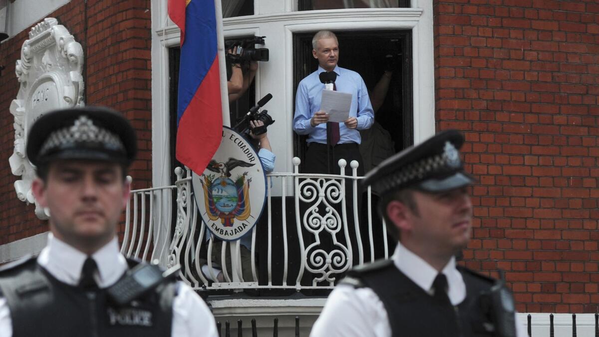 WikiLeaks founder Julian Assange addresses the media and his supporters from the balcony of the Ecuadorean Embassy in London on Aug. 19, 2012.