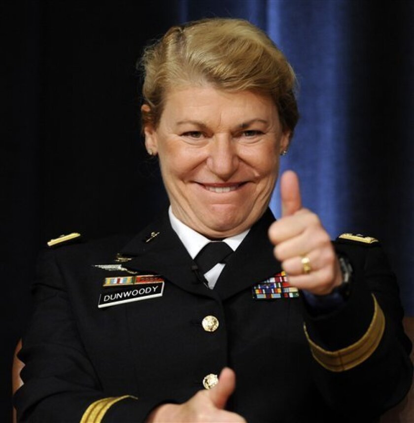 Gen. Ann E. Dunwoody gives a thumbs up to recognize her father, retired Brig. General Harold H. Dunwoody, of Engelwood, Fla., not pictured, Friday, Nov. 14, 2008, during her promotion ceremony to four-star General at the Pentagon. (AP Photo/Susan Walsh)