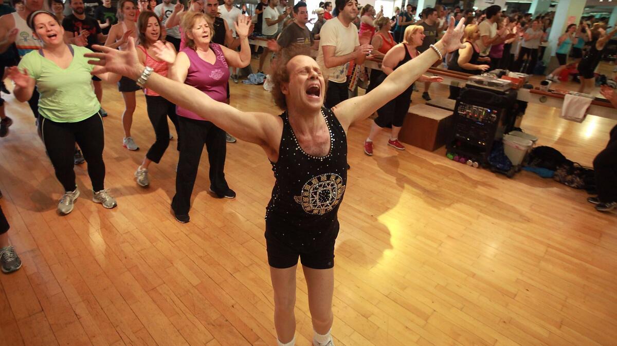 Fitness guru Richard Simmons works with the crowd at his Beverly Hills studio in 2013.