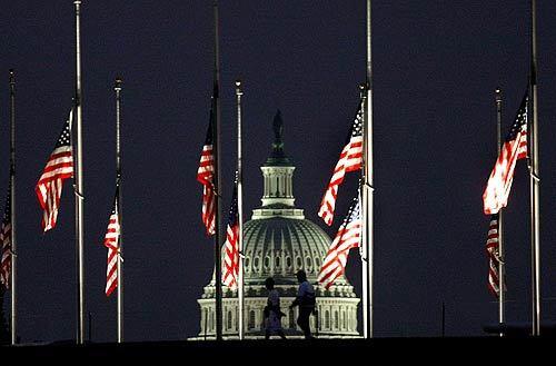 Flags fly at half-staff Tuesday at the U.S. Capitol to mark the sixth anniversary of the Sept. 11, 2001, attacks. In New York, families of the victims mourned inside the pit where the two towers crumbled and a park near ground zero served as the memorial site. At the Pentagon, officials held a service near the section of the building, now rebuilt, into which United Flight 77 crashed at 9:39 a.m, while at 9:55 a.m. in Shanksville, Pa., a memorial began at the field where United Flight 93 crashed after passengers stormed the cockpit of the hijacked plane.