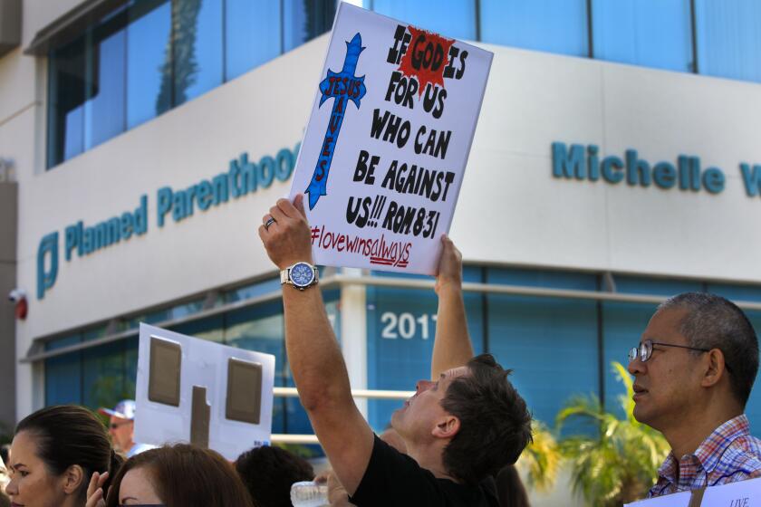 August 22, 2015, SAN DIEGO, CA | Richard Higgins of Rancho Bernardo was one of between 150-200 pro-life supporters who gathered in front of the Planned Parenthood offices in Bankers Hill, protesting Planned Parenthood who is accused of selling aborted fetal tissue for profit. This is one of more than 300 similar protests held around the country, Saturday. |Photo by Howard Lipin/The San Diego Union-Tribune/Mandatory Credit: HOWARD LIPIN/THE SAN DIEGO UNION-TRIBUNE/ZUMA PRESS. The San Diego Union-Tribune Copyright 2015