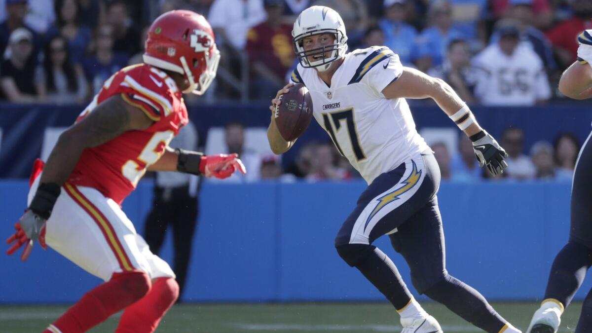 Chargers quarterback Philip Rivers avoids pressure as he looks downfield to pass against the Chiefs at StubHub Center during last year's meeting between the two teams. Chargers will face off against the Chiefs in Week 1.
