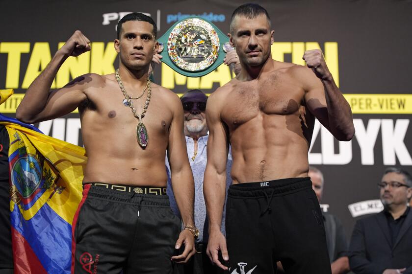 David Benavidez, left, and Oleksandr Gvozdyk pose during a weigh-in Friday, June 14, 2024, in Las Vegas. The two are scheduled to fight in a WBC interim light heavyweight title fight Saturday in Las Vegas. (AP Photo/John Locher)