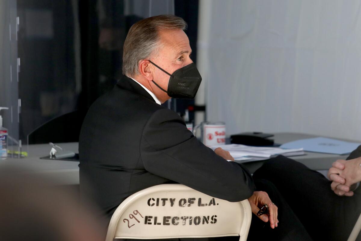  Rick Caruso waits for his paperwork to be filed to run for mayor of Los Angeles at the city clerk's office in downtown L.A. 