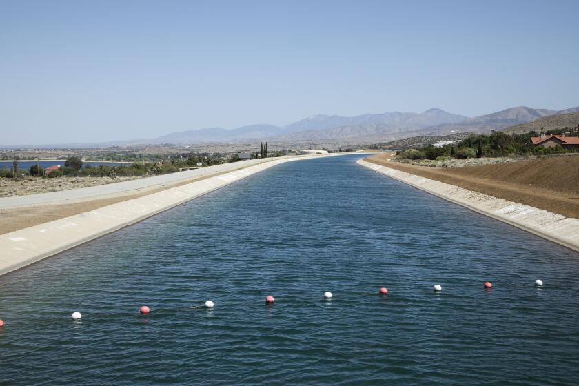 PALMDALE, CA - MAY 02: The California Aqueduct flows through Palmdale on Monday, May 2, 2022. For drought-related stories. (Myung J. Chun / Los Angeles Times)