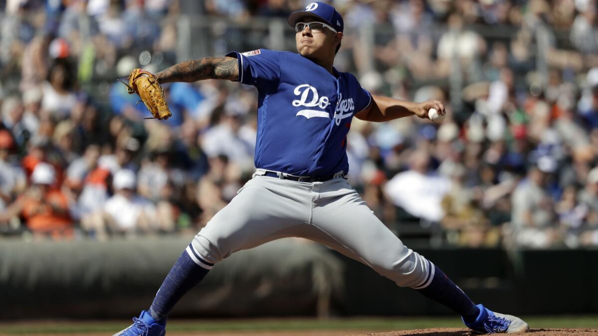 Dodgers starting pitcher Julio Urias throws in a spring training game in Scottsdale, Ariz.