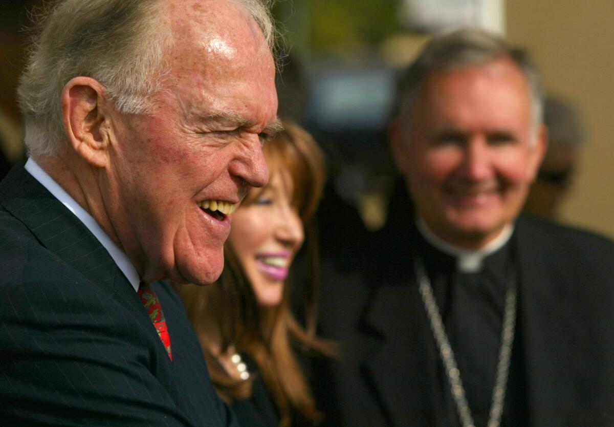 Henry and Elizabeth Segerstrom joined Bishop Tod D. Brown in this 2002 photo at the proposed Roman Catholic Christ Our Savior Cathedral Parish. The site was once a lima bean field owned by the Segerstrom family. Henry Segerstrom died Friday at age 91.