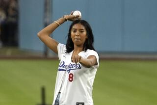 Natalia Bryant, daughter of Kobe Bryant, throws out the ceremonial first pitch.