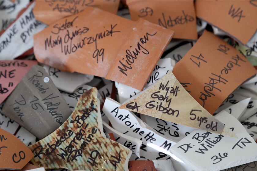 The names, ages and city of Wyatt Gary Gibson, 5, of Georgia, and Sister Mary Luisa Wawryzyniak, 99, of Michigan, are two out of the 3,000 lives lost that are recorded on broken ceramic pieces as part of "Shards: In Memoriam" a ceramic memorial at Coastal Eddy Gallery in Laguna Beach.