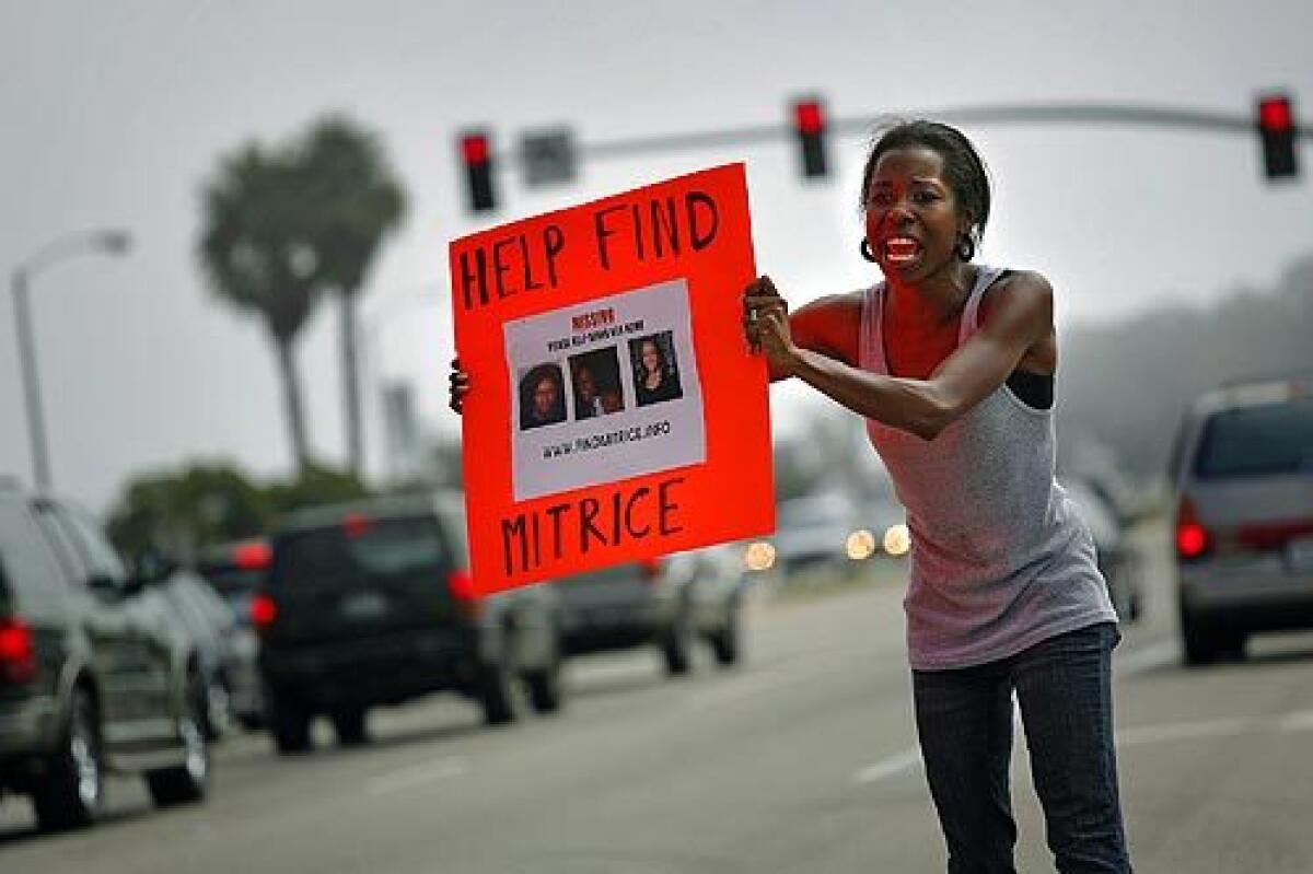 Cherise Rogers, 27, of Hawthorne, standing on Pacific Coast Highway at Webb Way in Malibu, was among the volunteers helping get the word out Saturday about the search for Mitrice Richardson, 24, who disappeared Sept. 17 after being released from a sheriff's substation in Calabasas. More photos >>>