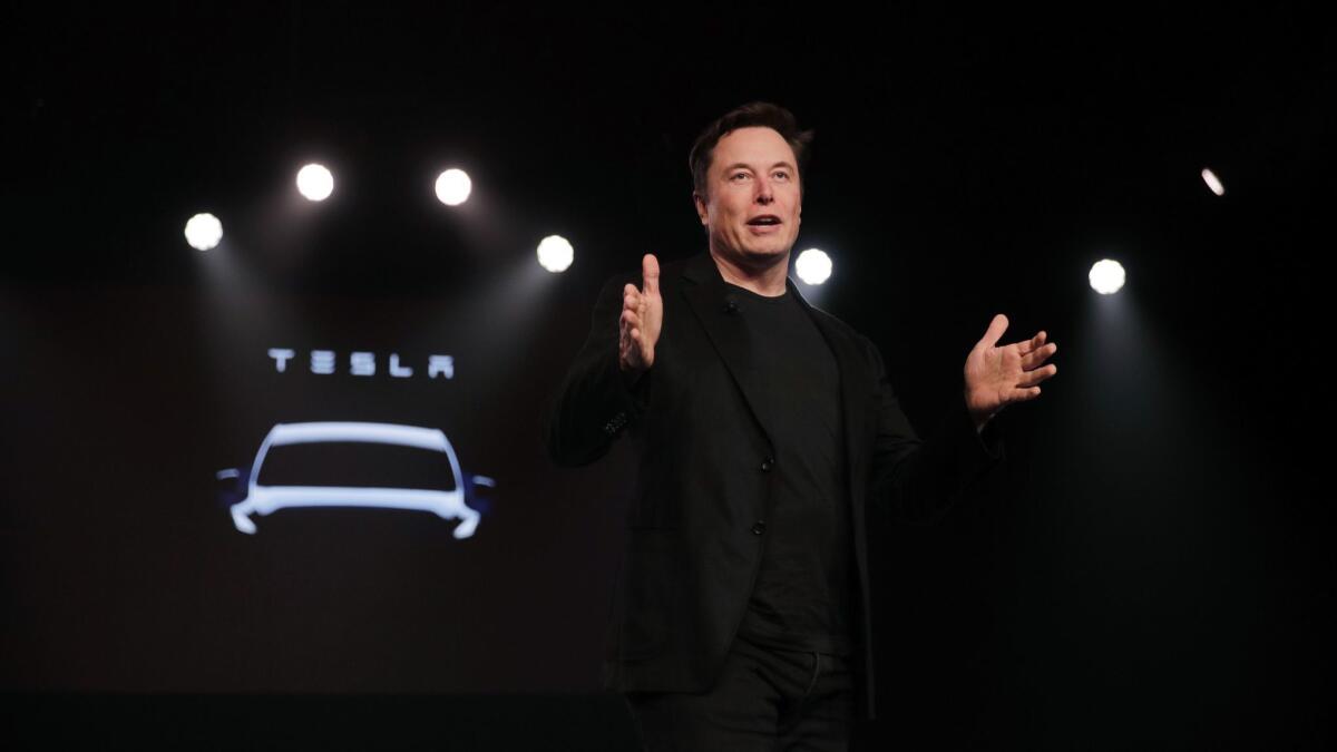 Tesla CEO Elon Musk speaks before unveiling the Model Y at Tesla's design studio in Hawthorne, Calif., on March 14.