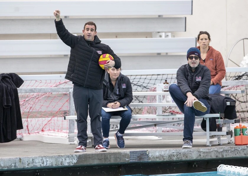 Laguna Beach boys' water polo coach Ethan Damato, left, led the Breakers to a win at CdM on Wednesday night.