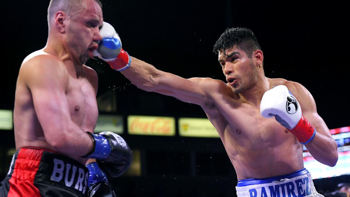 Gilberto Ramirez lands a right jab to the face of Maxim Bursak during a WBO super-middleweight title fight Saturday.