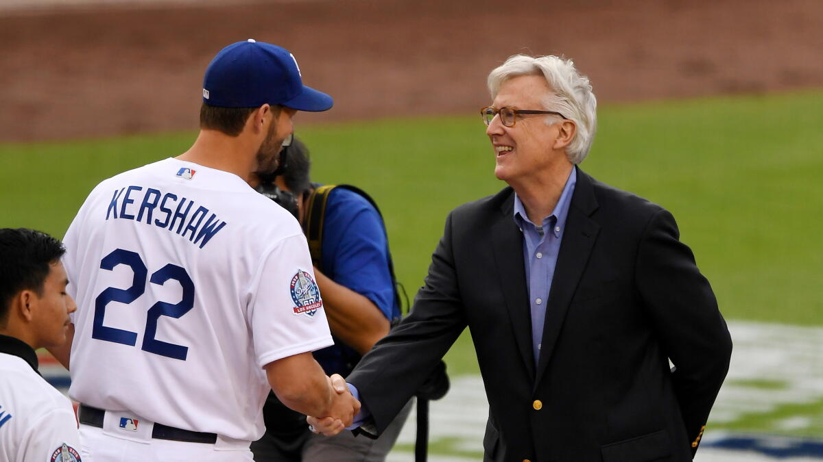 Mark Walter at a public event, accompanying Los Angeles Times coverage of the federal inquiry into his financial dealings and the potential impact on the Dodgers.