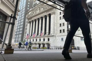 FILE - People pass the New York Stock Exchange on Aug. 27, 2024, in New York. (AP Photo/Peter Morgan, File)