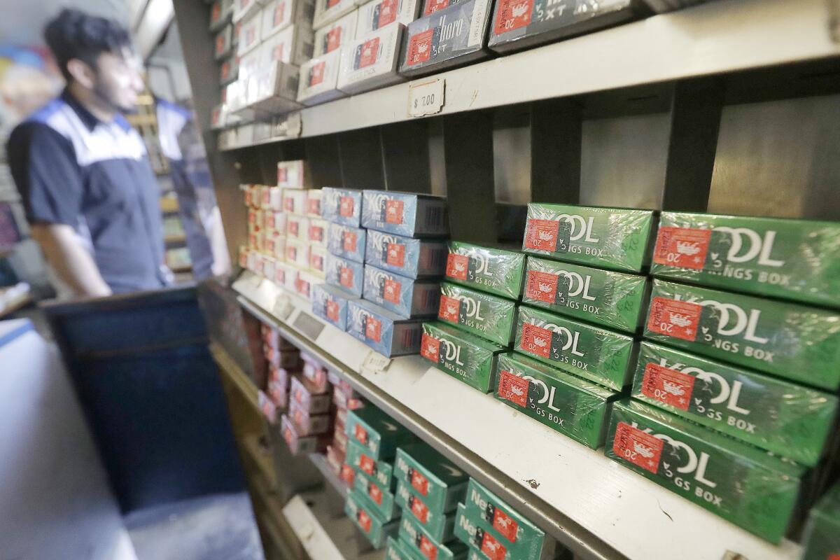 FILE - This May 17, 2018 file photo shows packs of menthol cigarettes and other tobacco products.