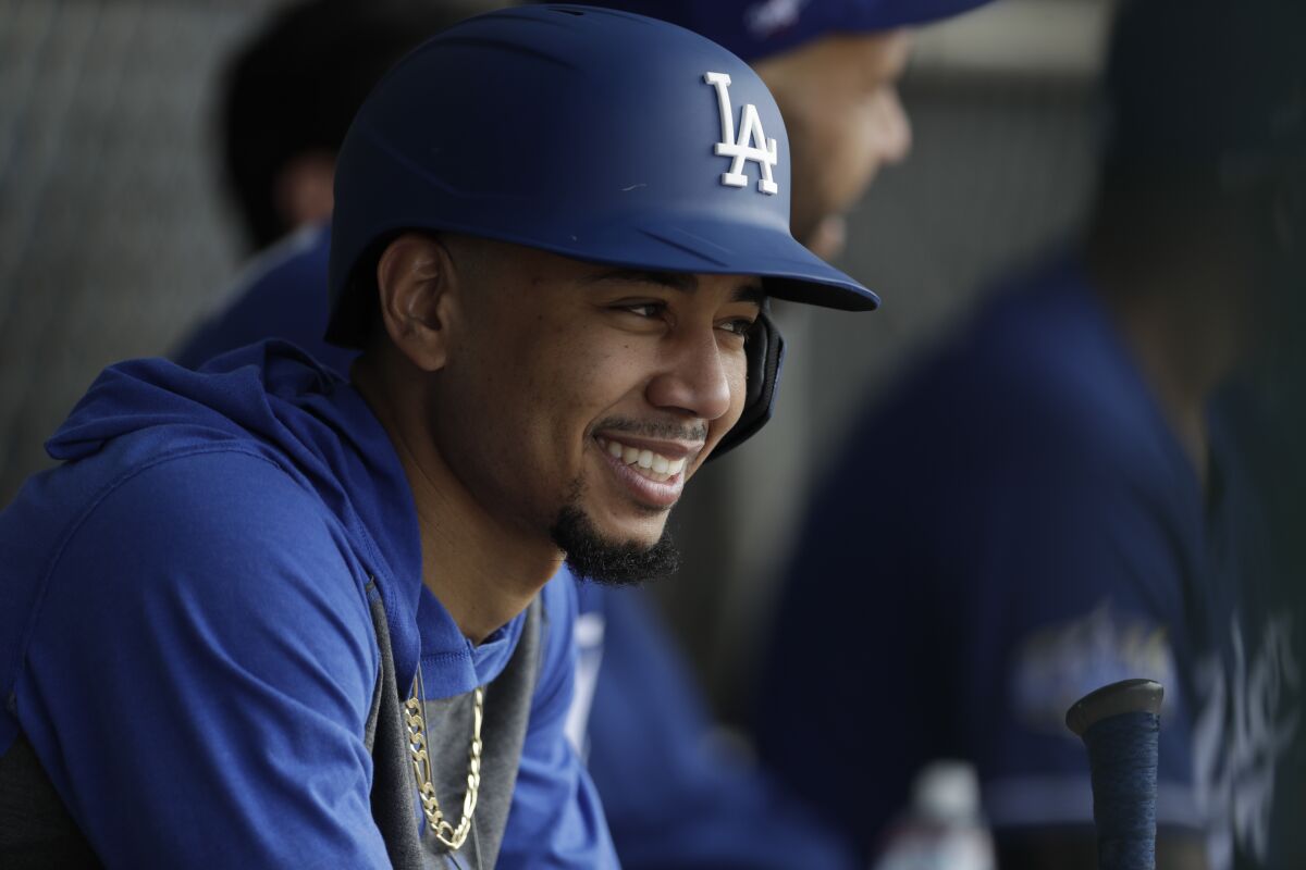 Dodgers right fielder Mookie Betts smiles during spring training Feb. 21