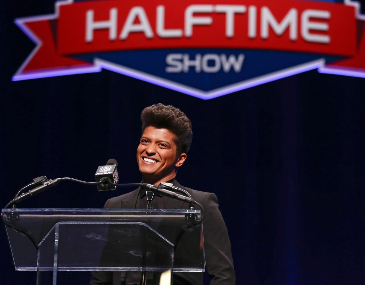 Pop artist Bruno Mars speaks at a Super Bowl LXVIII news conference this week in New York.