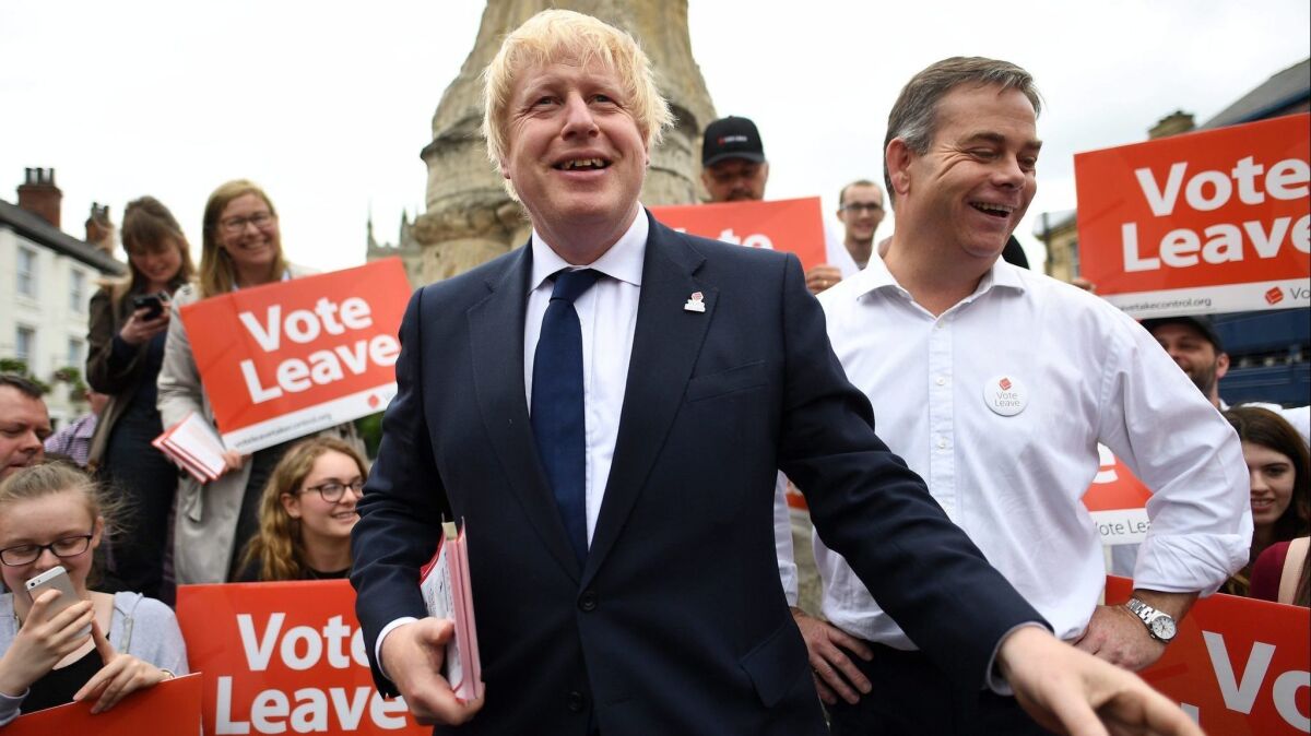British Member of Parliament and former London Mayor Boris Johnson (L) in Selby during a campaign visit in Central London on June 22, 2016 — the day before the Brexit vote.