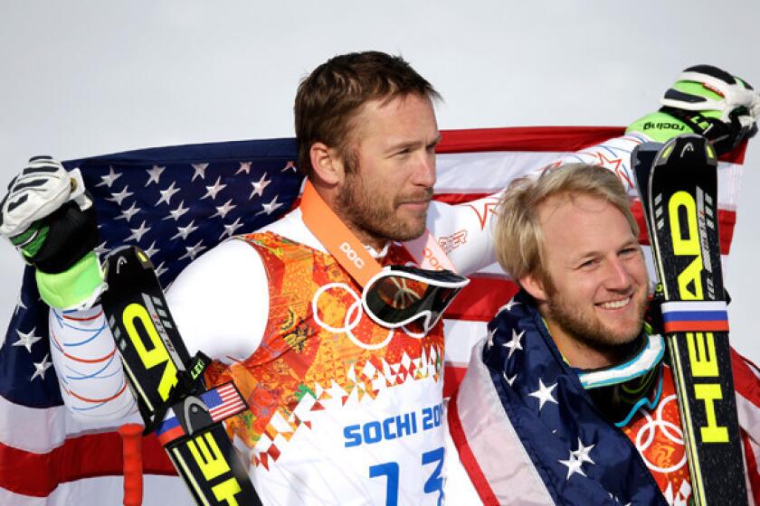 Bronze medalist Bode Miller, left, and silver medalist Andrew Weibrecht of the United States celebrate after the men's super-giant slalom race at the Sochi Olympics on Sunday at Rosa Khutor Alpine Center.