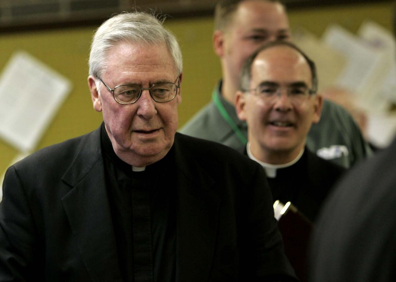 Bishop Joseph Imesch, left, whose 27-year tenure over the Joliet Diocese was tarnished by his actions in connection with the Catholic Church's priest sex-abuse scandal, died Dec. 22 at age 84. Read the obituary