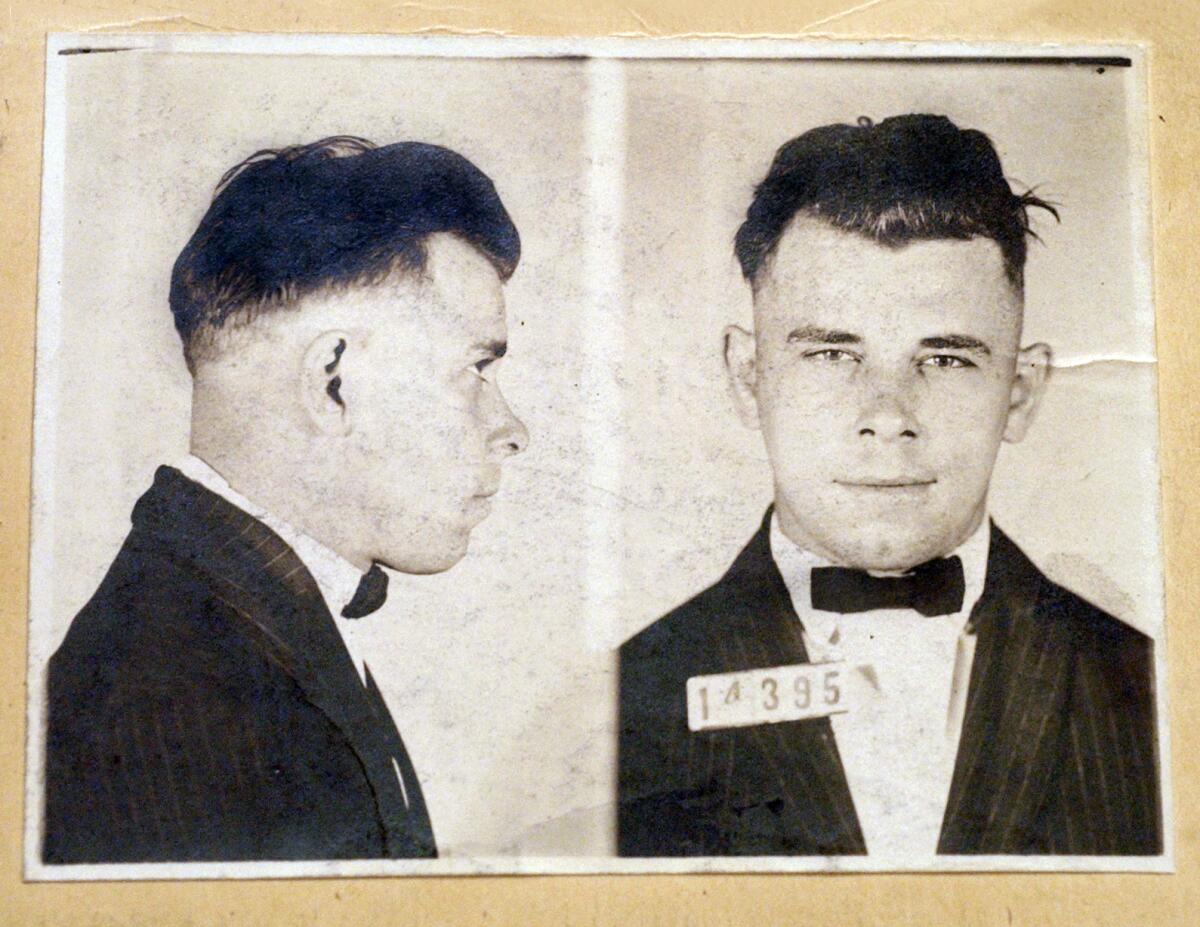 FILE - This undated file photo shows Indiana Reformatory booking shots of John Dillinger, stored in the state archives. A judge will hear an Indianapolis cemetery's bid Wednesday, Nov. 4, 2019, to dismiss a lawsuit filed by a relative of the 1930s gangster who wants to exhume Dillinger’s gravesite to determine if the notorious criminal is actually buried there. (Indiana State Archives/The Indianapolis Star via AP, File)