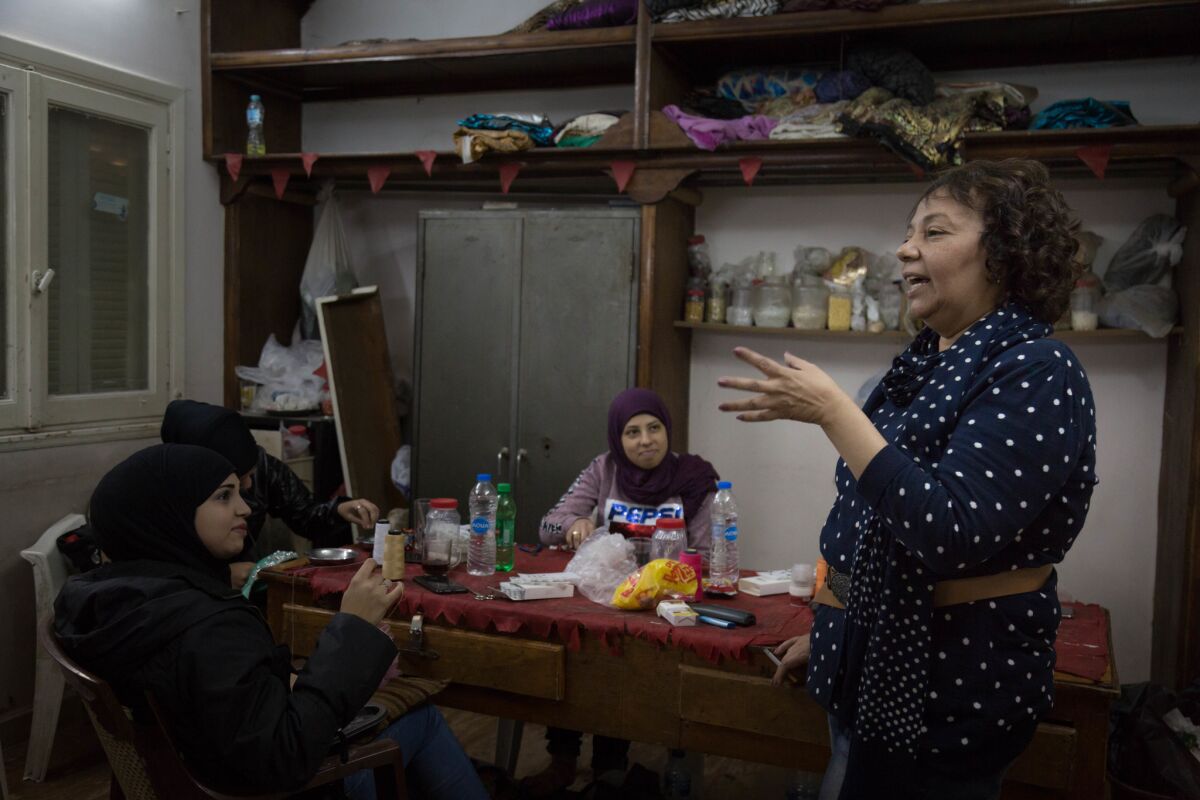 Eman Zaki speaks to seamstresses in her costume design workshop. (Sima Diab / For The Times)